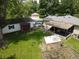 Aerial shot of backyard shows detached garage, greenhouse, patio at 1029 Price Rd, Avon, IN 46123