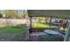 Backyard featuring a greenhouse, garden beds, and outdoor seating area at 1029 Price Rd, Avon, IN 46123