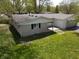 A charming ranch-style home with a large green lawn and mature trees at 1029 Price Rd, Avon, IN 46123