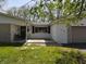 Ranch-style home featuring a front porch swing, shuttered windows, and well-maintained lawn at 1029 Price Rd, Avon, IN 46123