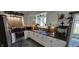 Well-lit kitchen with white cabinets, stainless steel appliances, and dark countertops at 1029 Price Rd, Avon, IN 46123