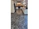Open kitchen with white cabinets, modern appliances, and unique marble-style floor at 1029 Price Rd, Avon, IN 46123