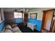 Cozy living room featuring built-in shelves and blue accent walls at 1029 Price Rd, Avon, IN 46123