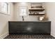 Well-organized laundry room with dark cabinets, stylish hardware, sink, and ample storage at 10415 Westfield Blvd, Carmel, IN 46280