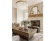 Cozy living room features a stone fireplace, natural light, and a comfortable seating area at 10415 Westfield Blvd, Carmel, IN 46280