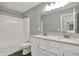 Bathroom featuring double sink vanity and shower-tub combo at 10423 Hamburg Dr, Fortville, IN 46040