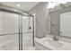 Bathroom with a glass-enclosed shower and a white vanity featuring a granite countertop and a brushed nickel faucet at 10423 Hamburg Dr, Fortville, IN 46040