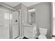This bathroom features a vanity, toilet, and walk-in shower at 10423 Hamburg Dr, Fortville, IN 46040