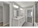 Bathroom featuring double sink vanity with quartz countertop at 10423 Hamburg Dr, Fortville, IN 46040