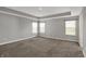 This bedroom is spacious with natural light and plush carpet at 10423 Hamburg Dr, Fortville, IN 46040
