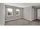 Empty bedroom with two windows and neutral walls offering a blank canvas for personalization at 10423 Hamburg Dr, Fortville, IN 46040