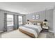 This bedroom features a comfortable bed, modern decor, and large windows that fill the room with natural light at 10423 Hamburg Dr, Fortville, IN 46040