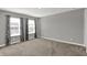 This bedroom is spacious with three windows that fill the room with natural light at 10423 Hamburg Dr, Fortville, IN 46040