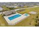 Aerial view of the community pool area, with swimming pools and playground nearby at 10423 Hamburg Dr, Fortville, IN 46040