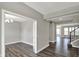 Inviting entryway showcasing gray walls, modern floors, and an open floor plan leading into other living spaces at 10423 Hamburg Dr, Fortville, IN 46040