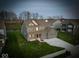 Gorgeous two-story home boasts a three-car garage and a meticulously manicured lawn at 10423 Hamburg Dr, Fortville, IN 46040