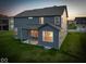Exterior of home showcases the well-maintained lawn and covered back patio at 10423 Hamburg Dr, Fortville, IN 46040