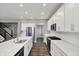 Bright kitchen with stainless steel appliances, subway tile backsplash, and a large island at 10423 Hamburg Dr, Fortville, IN 46040