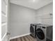This laundry room has modern appliances, and a wire rack at 10423 Hamburg Dr, Fortville, IN 46040
