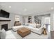 Spacious living room featuring a fireplace, hardwood floors, and a comfortable sectional sofa at 10423 Hamburg Dr, Fortville, IN 46040