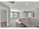 Spacious loft with natural light and neutral walls creating a versatile space for relaxing or entertaining at 10423 Hamburg Dr, Fortville, IN 46040