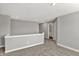 View of loft area with plush carpet and access to bathroom and bedroom at 10423 Hamburg Dr, Fortville, IN 46040