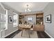Stylish home office with custom built-in shelves, modern decor, and a comfortable workspace at 10423 Hamburg Dr, Fortville, IN 46040