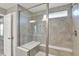 Bright walk-in shower with glass enclosure and bench seating at 10423 Hamburg Dr, Fortville, IN 46040