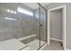 Contemporary walk-in shower with glass enclosure and bench seating at 10423 Hamburg Dr, Fortville, IN 46040