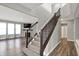 Staircase leading to the upper level, showcasing a modern design and neutral color palette at 10423 Hamburg Dr, Fortville, IN 46040