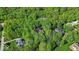An aerial view of homes nestled amongst a large forest of lush trees at 10561 Wilson Rd, Brownsburg, IN 46112