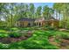 Expansive landscaped backyard with mature trees offering privacy and a serene setting at 10561 Wilson Rd, Brownsburg, IN 46112