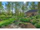 Lush backyard garden featuring vibrant plants, flowers, and manicured lawn at 10561 Wilson Rd, Brownsburg, IN 46112