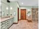 Light and bright bathroom with double sinks, and a large glass enclosed shower at 10561 Wilson Rd, Brownsburg, IN 46112