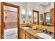 Bright bathroom featuring double sinks and a shower tub combo at 10561 Wilson Rd, Brownsburg, IN 46112