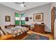 Bedroom with multiple windows, hardwoord floors and a ceiling fan at 10561 Wilson Rd, Brownsburg, IN 46112