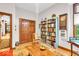 Inviting den with a bookshelf, wooden accents, and ample natural light at 10561 Wilson Rd, Brownsburg, IN 46112