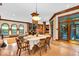 Open-concept dining room, which flows into other living spaces, features hardwood floors and natural lighting at 10561 Wilson Rd, Brownsburg, IN 46112