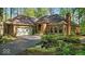Charming brick home featuring an attached garage, arched entryway, and well-maintained landscaping at 10561 Wilson Rd, Brownsburg, IN 46112