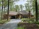Exterior front view of a brick home with a well-manicured lawn and a paved driveway at 10561 Wilson Rd, Brownsburg, IN 46112