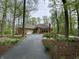 View of a single story home with a brick exterior, attached garage and driveway at 10561 Wilson Rd, Brownsburg, IN 46112