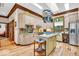 Well-equipped kitchen with stainless steel appliances, center island, skylights, and ample cabinet space at 10561 Wilson Rd, Brownsburg, IN 46112