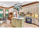 Stylish kitchen featuring custom cabinetry, a center island, and modern appliances, perfect for cooking at 10561 Wilson Rd, Brownsburg, IN 46112