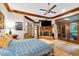 Comfortable main bedroom featuring a fireplace, tv and access to outdoor space at 10561 Wilson Rd, Brownsburg, IN 46112