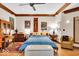 Inviting main bedroom with neutral tones, hardwood floors, and a view of the backyard at 10561 Wilson Rd, Brownsburg, IN 46112