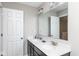 Bathroom featuring a double sink vanity with a full mirror and two light fixtures at 10810 Arendale Dr, Brownsburg, IN 46112