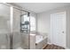 Bright bathroom featuring a glass shower, soaking tub, and plenty of shelf space for towels at 10810 Arendale Dr, Brownsburg, IN 46112