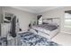 Bedroom with a gray shag rug, gray walls, and a bed with storage beneath at 10810 Arendale Dr, Brownsburg, IN 46112