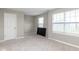 Empty bedroom featuring neutral carpet and walls, blinds on the window, and a door to the hallway at 10810 Arendale Dr, Brownsburg, IN 46112