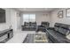 Inviting living room features black leather reclining furniture, a glass coffee table, and neutral decor at 10810 Arendale Dr, Brownsburg, IN 46112